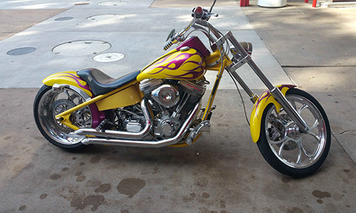 yellow motorcycle with red flames on the body